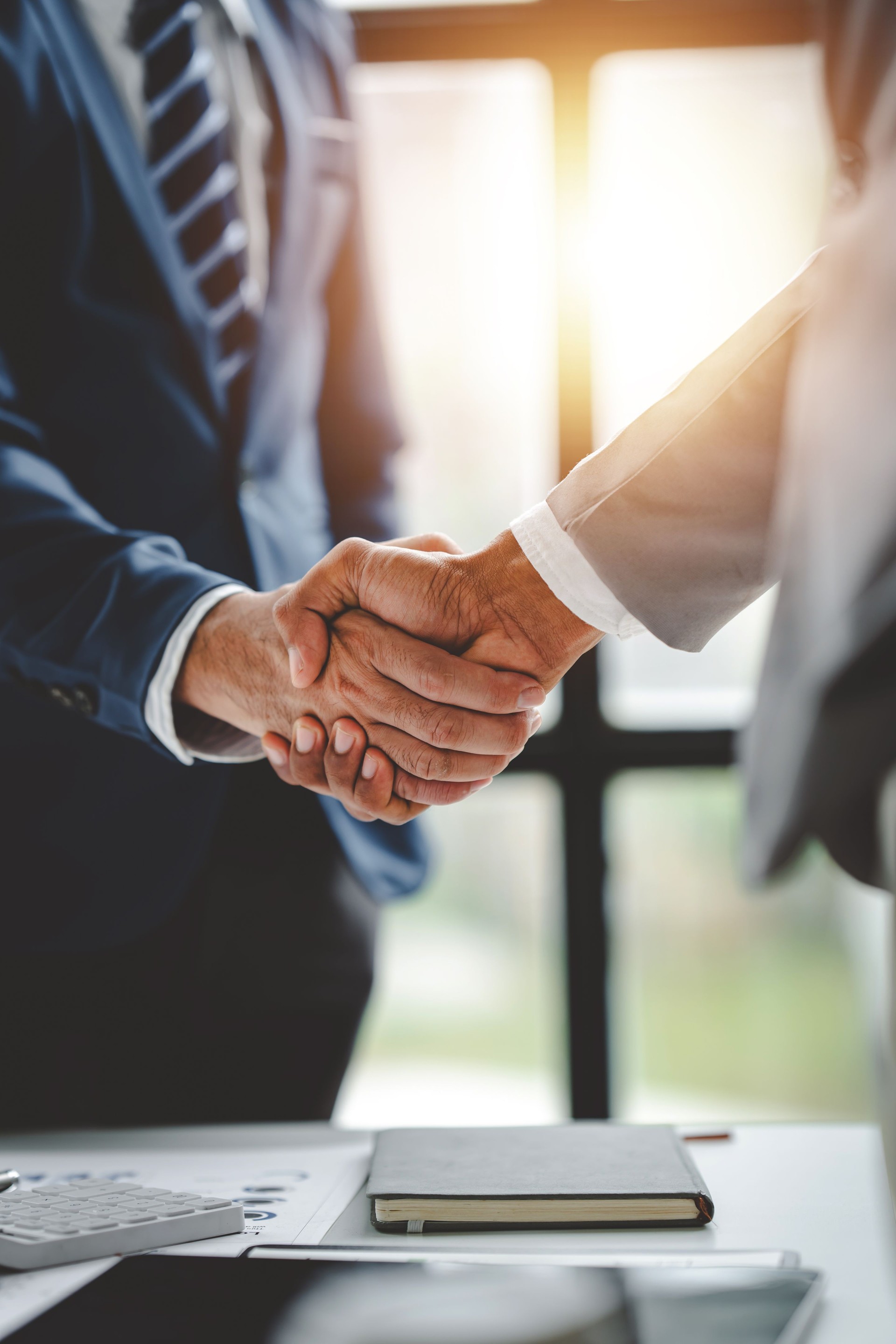 business partner handshake concept Colleagues shaking hands Successful deal after a great meeting. Blurred background. business partner handshake concept Colleagues shaking hands Successful deal after a great meeting. Blurred background.